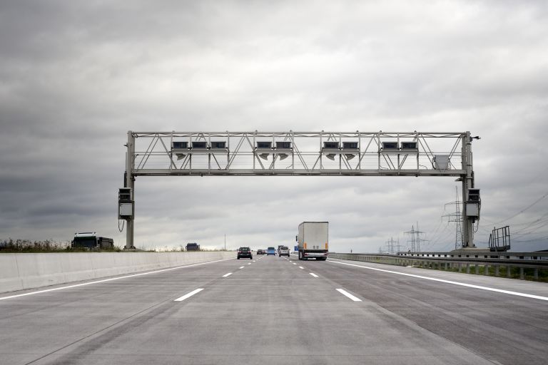 Tolling gantry and truck in the distance