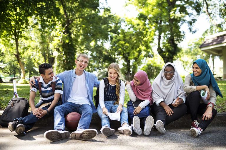 Group of multicultural youths sitting down