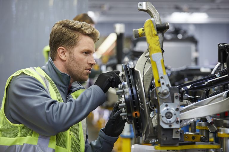 Man adjusting machine 