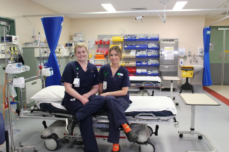 Two nurses with medical equipment