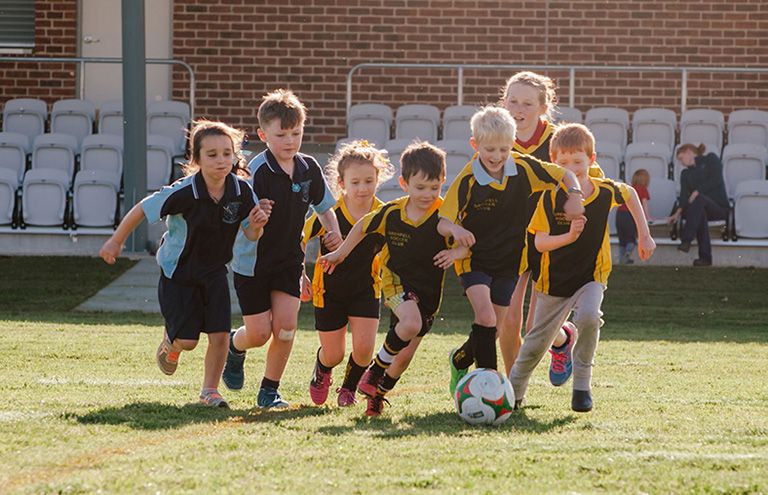 Children enjoying a game at the local Grenfell Soccer Club.