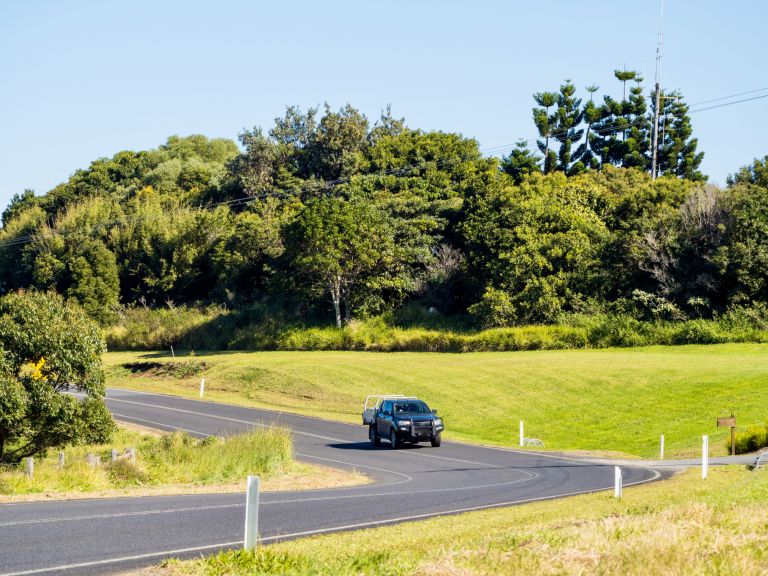 Blue ute driving on regional road