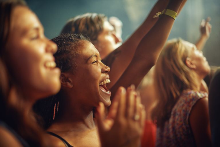 Audience members enjoying a performance