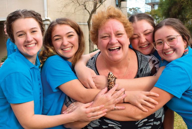 Nurses  and students hugging and smiling