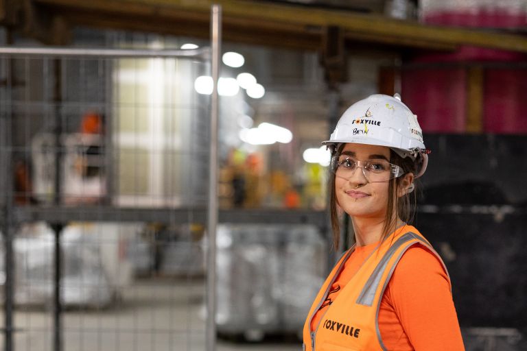 Bethany is standing on a construction site.