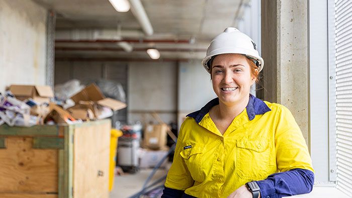 Woman in construction gear on worksite