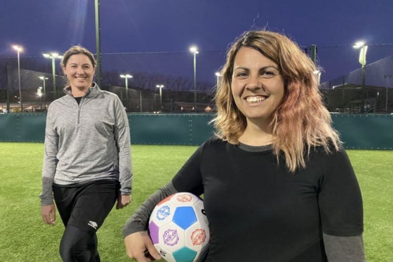 A photo of two women who play community sport.