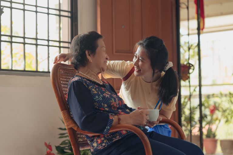 A granddaughter visits her grandmother