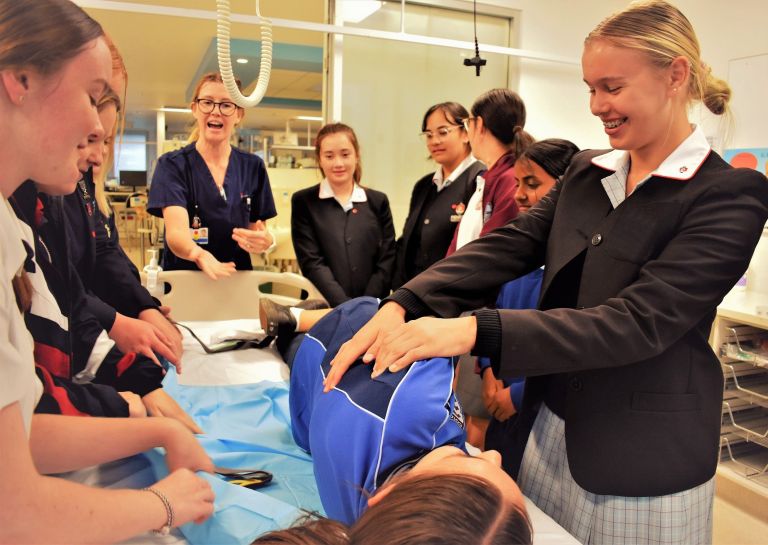 Work experience students getting practical experience at a hospital