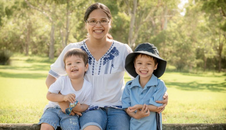 Mother smiling with two children