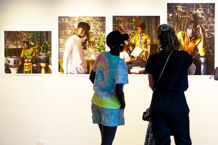 Two people looking at artwork in an art gallery