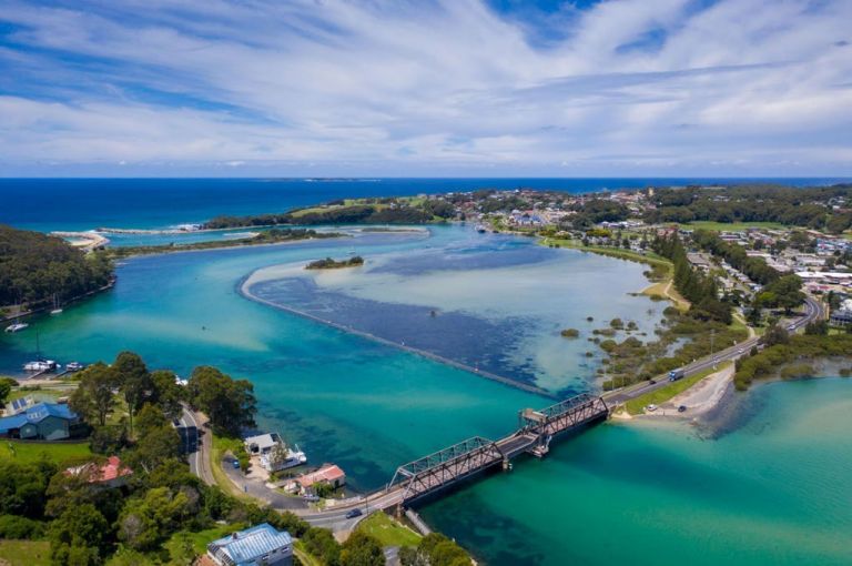 Aerial image of Wagonga, featuring a bridge going over an inlet