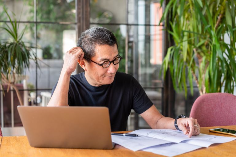 Senior male working at home