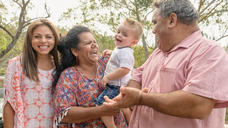 image of family smiling and laughing