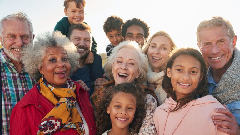 Portrait Of Multi-Generation Family Group On Winter Beach Vacation