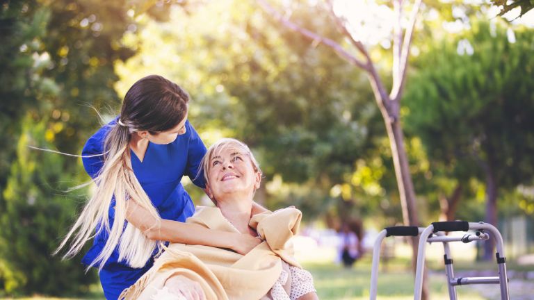 Nurse helping woman for comfort and care