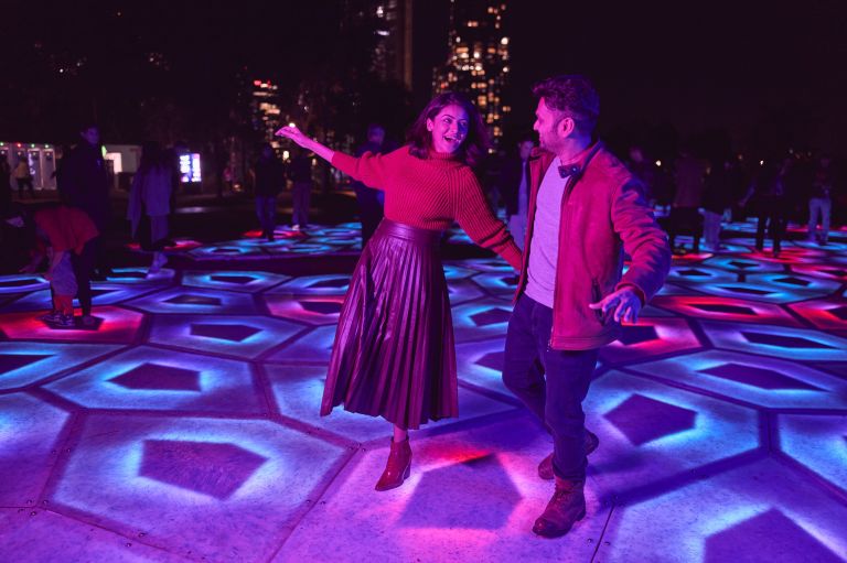 Couple enjoying the 'The Last Ocean' installation at Star Gazer Lawn, Barangaroo during Vivid 2023