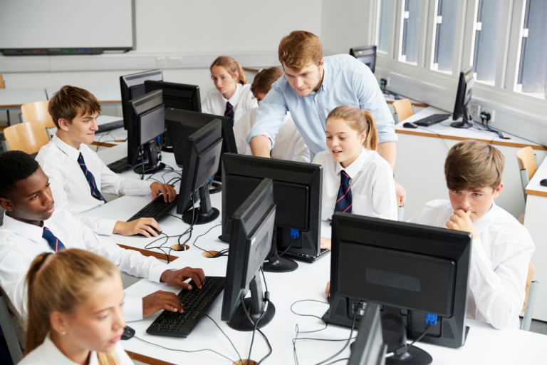 Teacher with class and computers