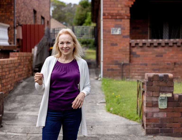 Older women with keys outside house