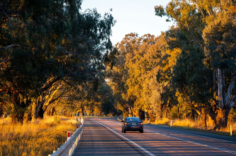 Car driving round a bend on a regional road 