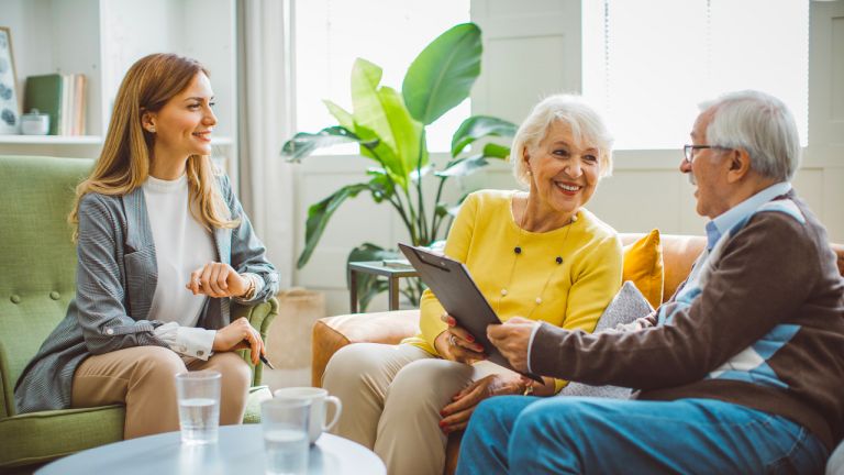 Senior couple consulting with agent