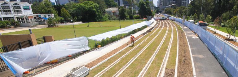 Parramatta Light Rail lays first green track alongside Robin Thomas Reserve.