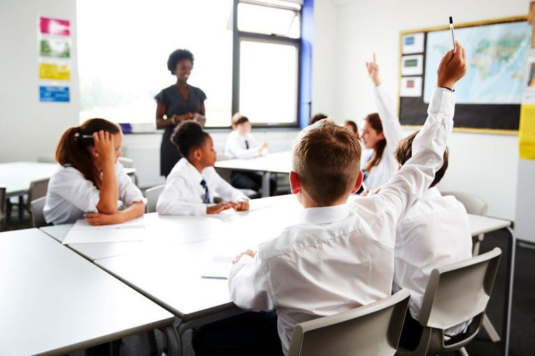 School children and teacher in a classroom