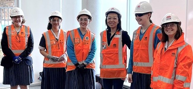 Students at Our Lady of Mercy College Parramatta wearing helmets and high visibility safety vests.