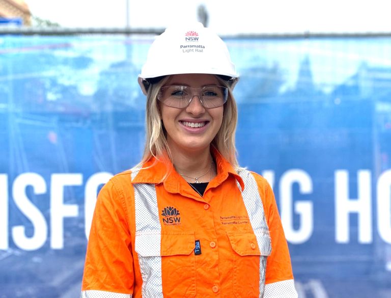 Female Parramatta Light Rail employee in safety attire.
