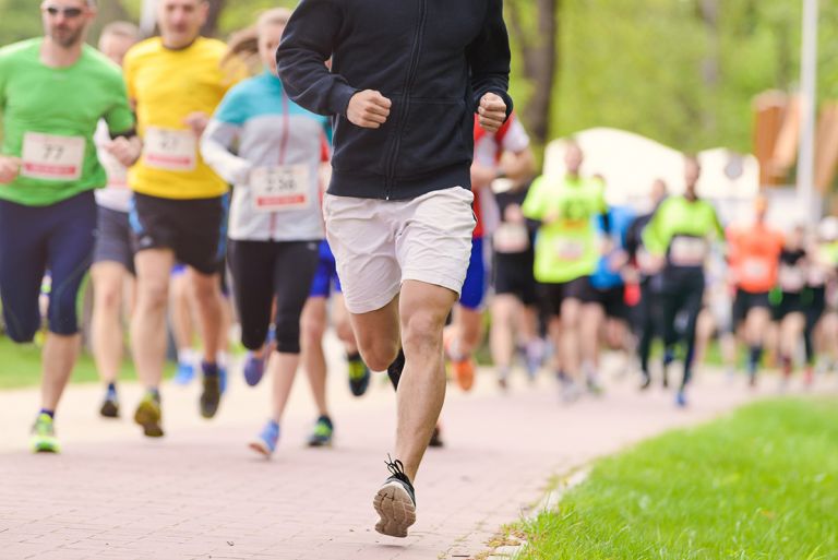 A group of people running in a charity race event