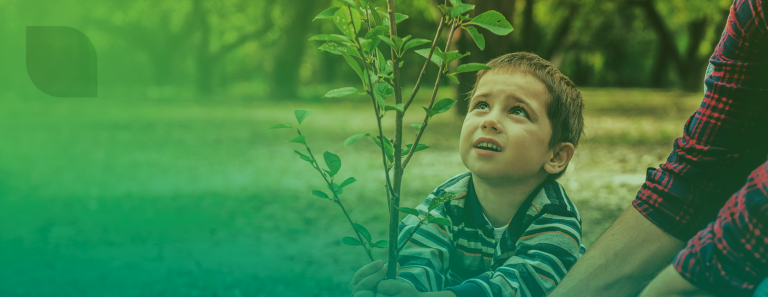 Child and man planting a tree 