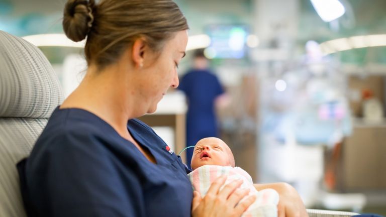 Nurse with newborn baby