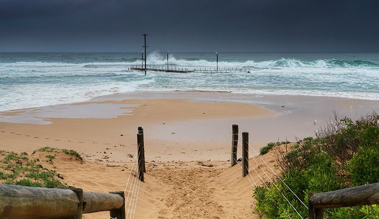 Waves and sand at Monavale beach in NSW Australia