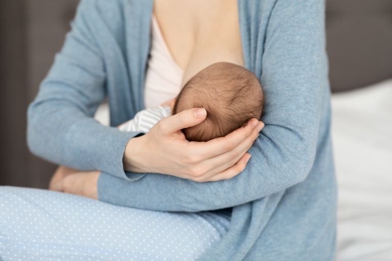 mother breastfeeding a baby