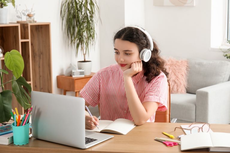 Stage 5 home schooled student looking at a laptop