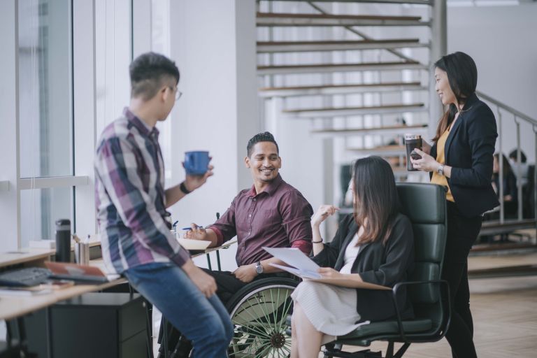 Group of office workers having a conversation. 