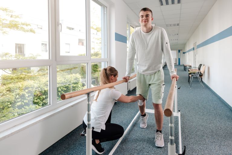 patient having rehabilitation treatment to help with walking after surgery