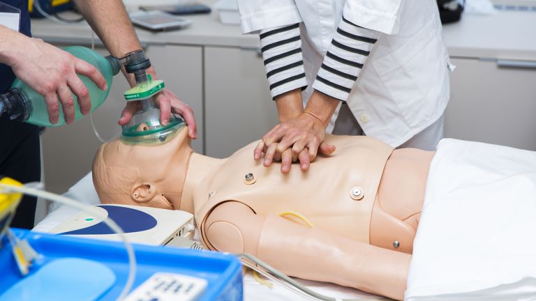 CPR simulation, mechanical ventilation and heart massage of dummy