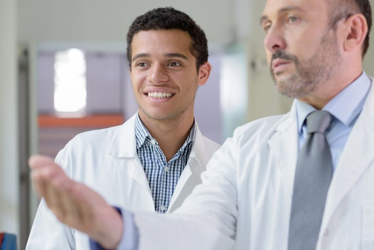 Junior doctor being trained in a hospital by senior doctor