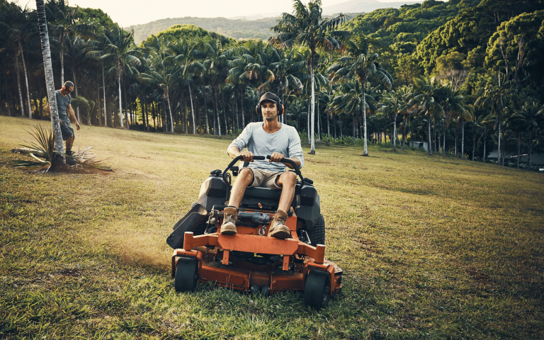 Small business owner on ride-on mower