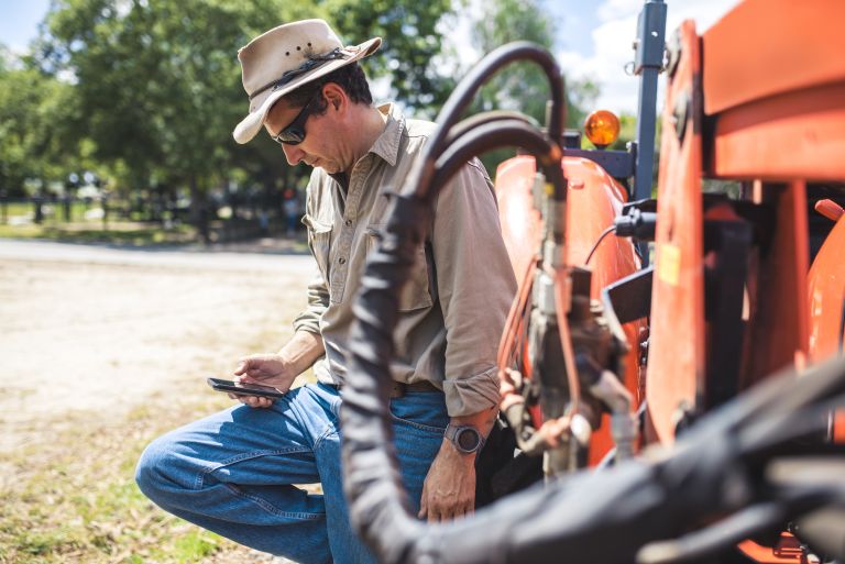 Farmer in the field on his phone