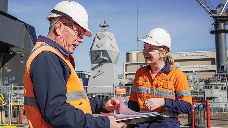 Female construction apprentice on site with supervisor