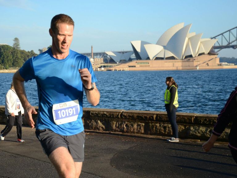 Man running 10k in Run2Cure at the Domain