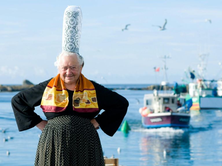 Bigoudaine standing near the water in Brittany