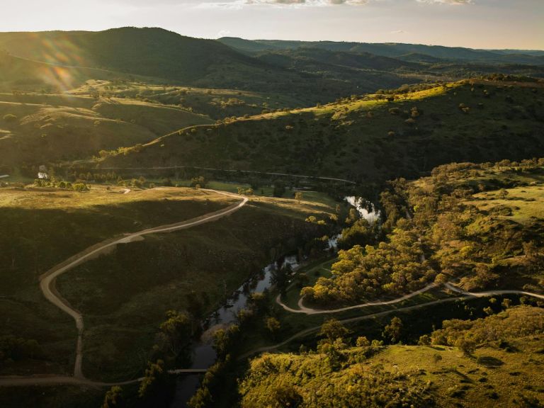 a high up drone shot of the road along the Bridle Track