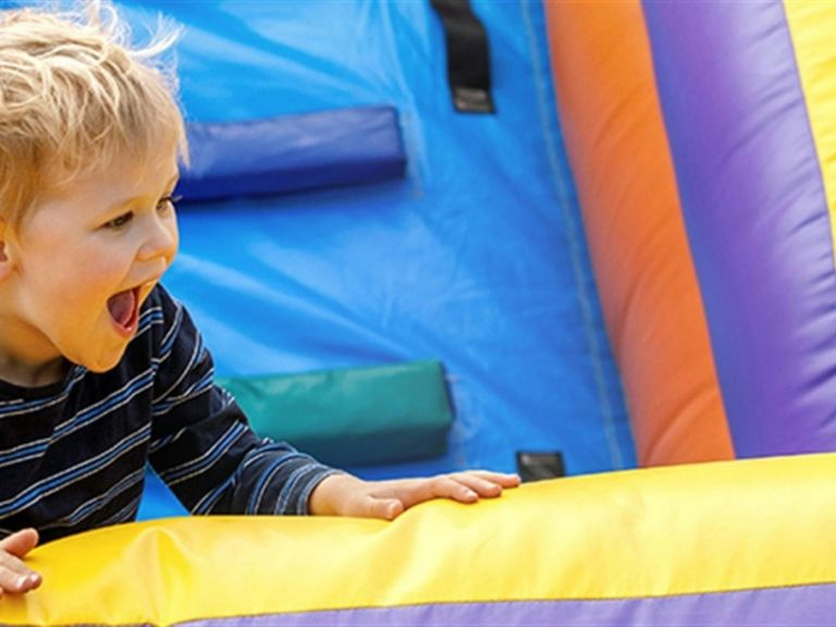 Boy on colourful Inflatable