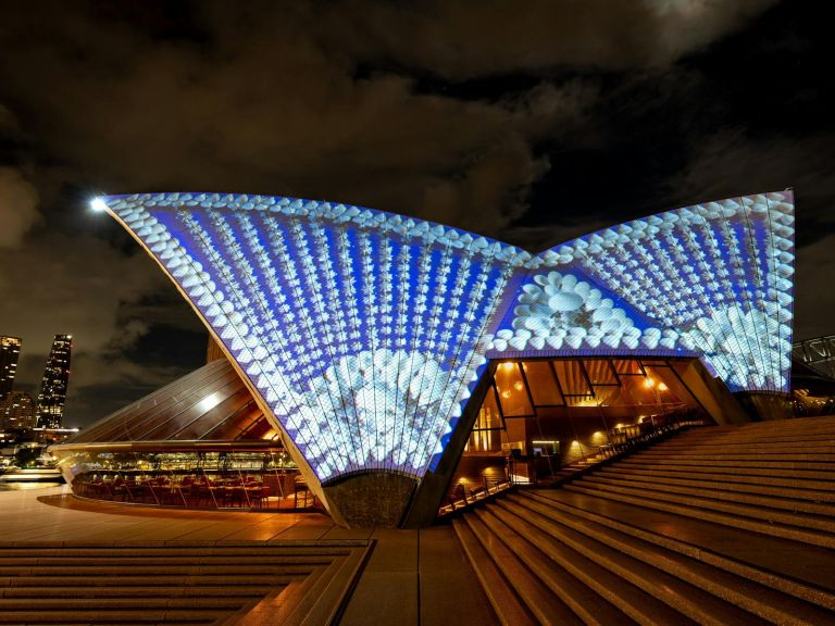 The sails light up with blue background and white shells