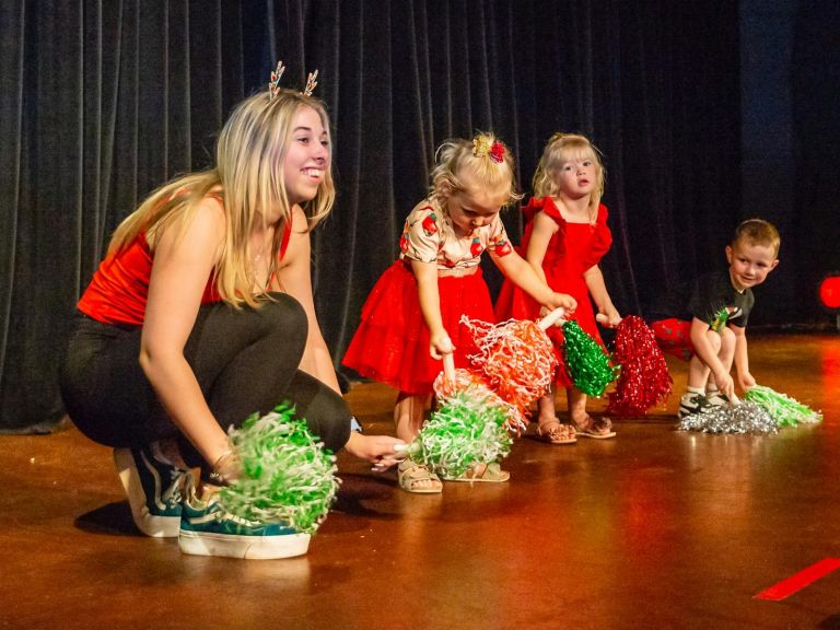 Children dancing group on stage