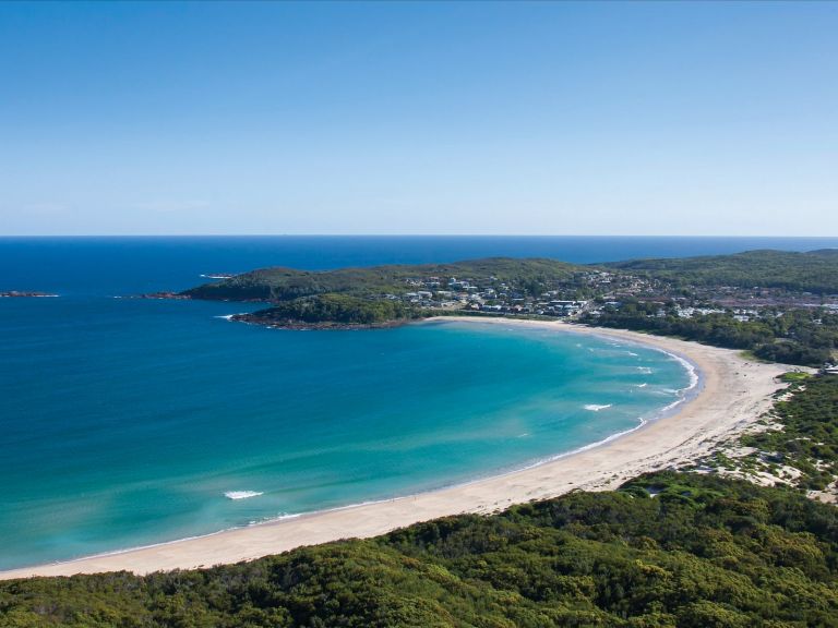 Coastal aerial of Fingal Beach in Fingal Bay, Port Stephens