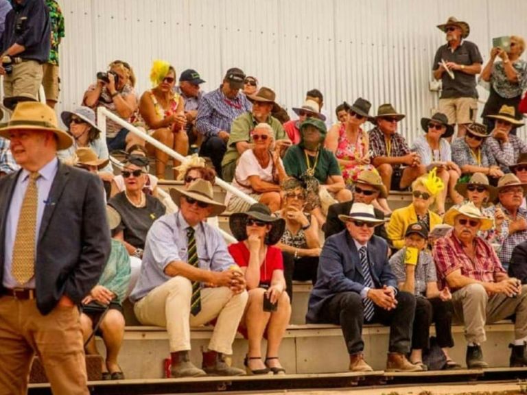 A group of people sitting on bleachers